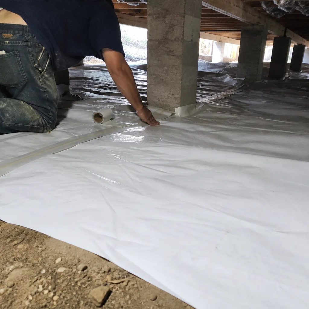 Professional crawl space encapsulation installation with vapor barrier and sealing tape
